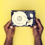 Hands Holding Hard Disk